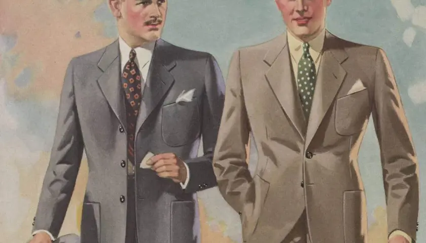 Två män i stilfulla kostymer, en med hatt, visar upp mode från 30-talet.