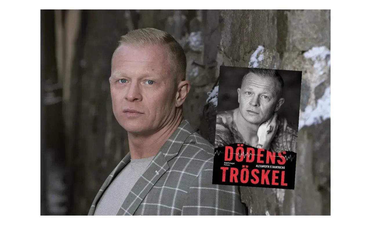 Alexander Strandberg, författare till "Dödens tröskel", poserar framför en stenvägg.